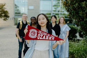 College Student with CofO pennant